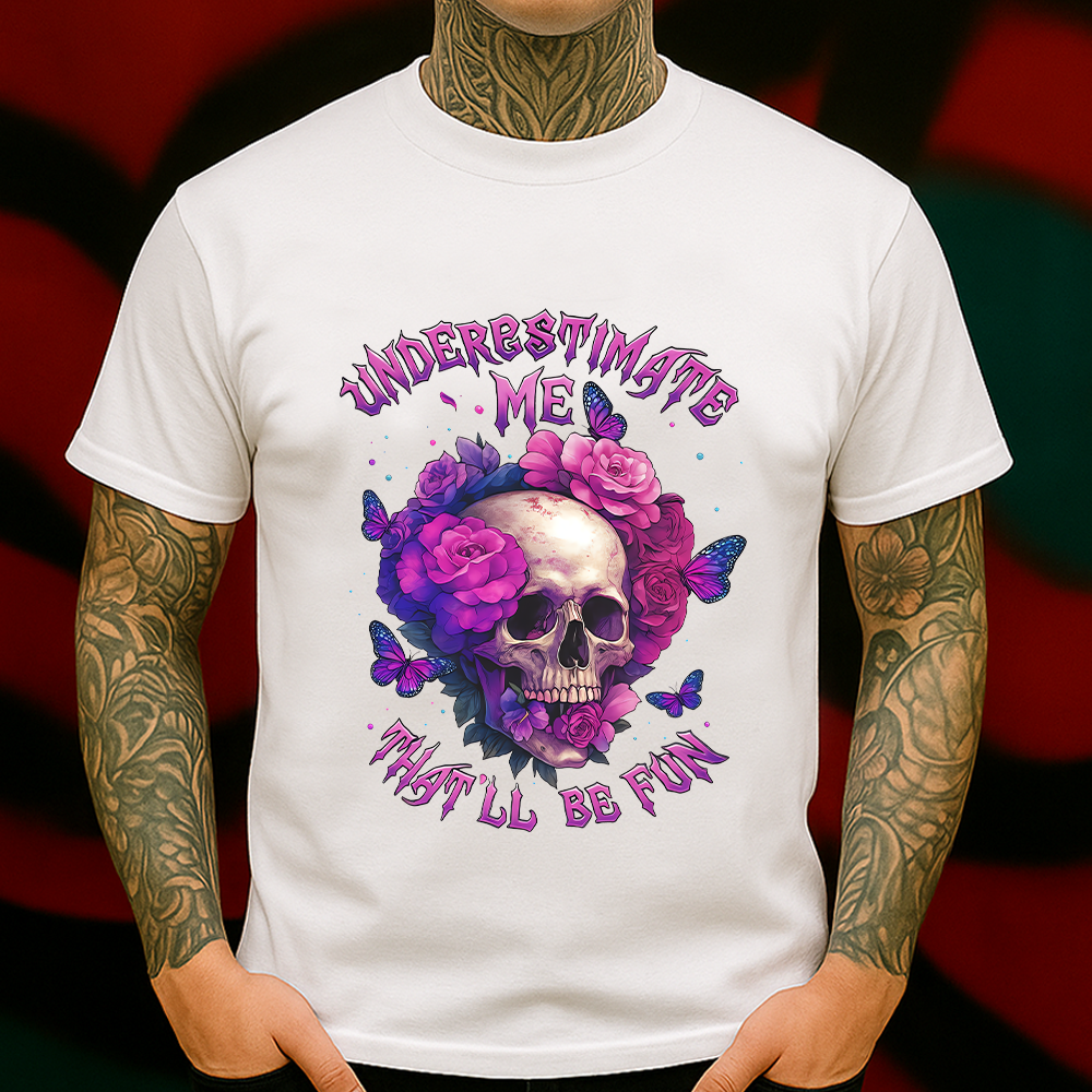 Underestimate Me Skull T-Shirt – Gothic Floral Skull with Butterflies and Bold Feminine Attitude, Perfect for Alternative Fashion Lovers.